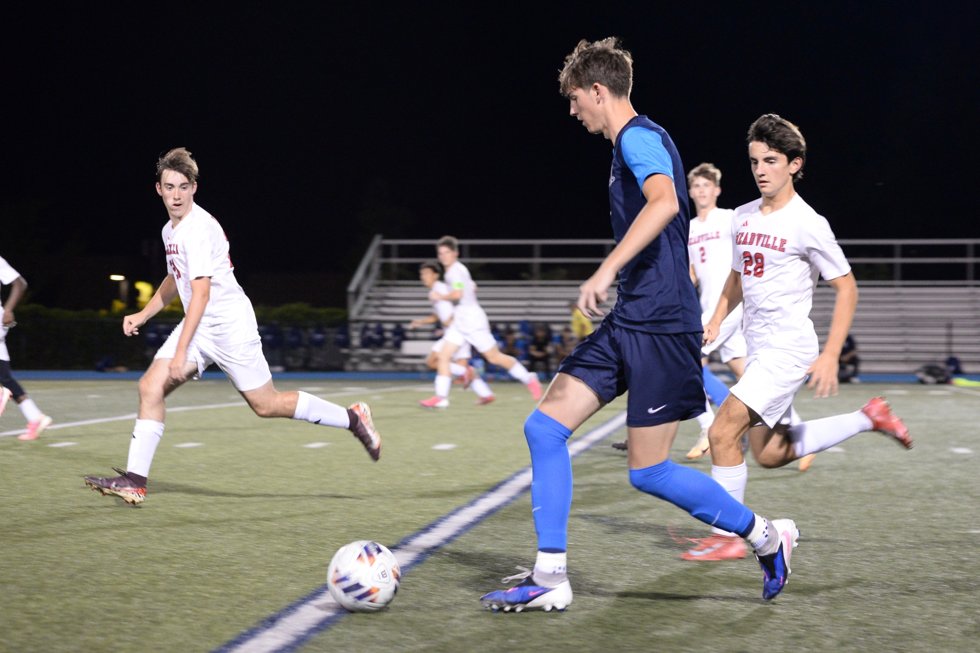 McDowell boys' soccer player controlling the ball during a game.
