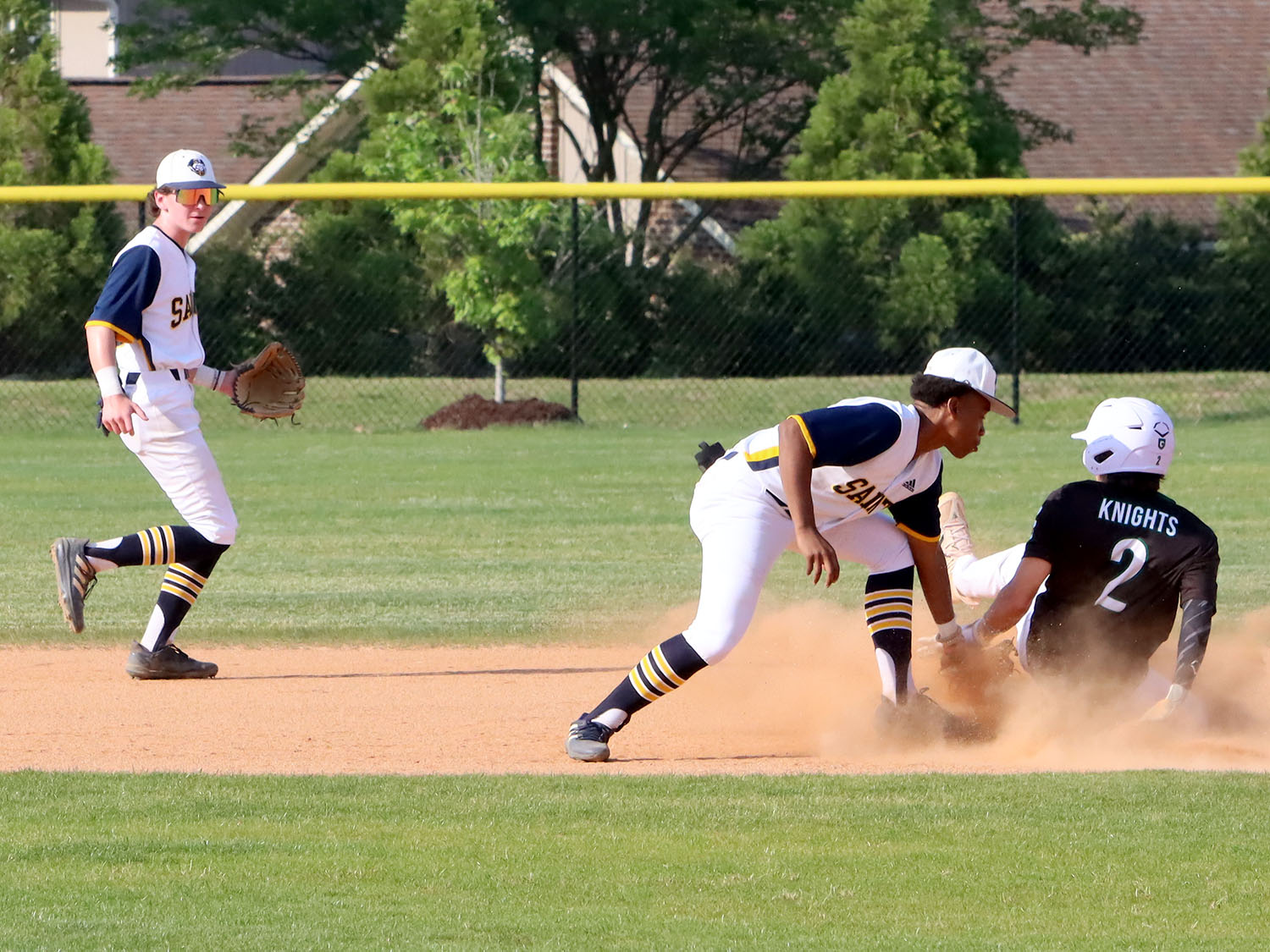 Nike Wiggins tags a Greenfield runner out at 2nd.