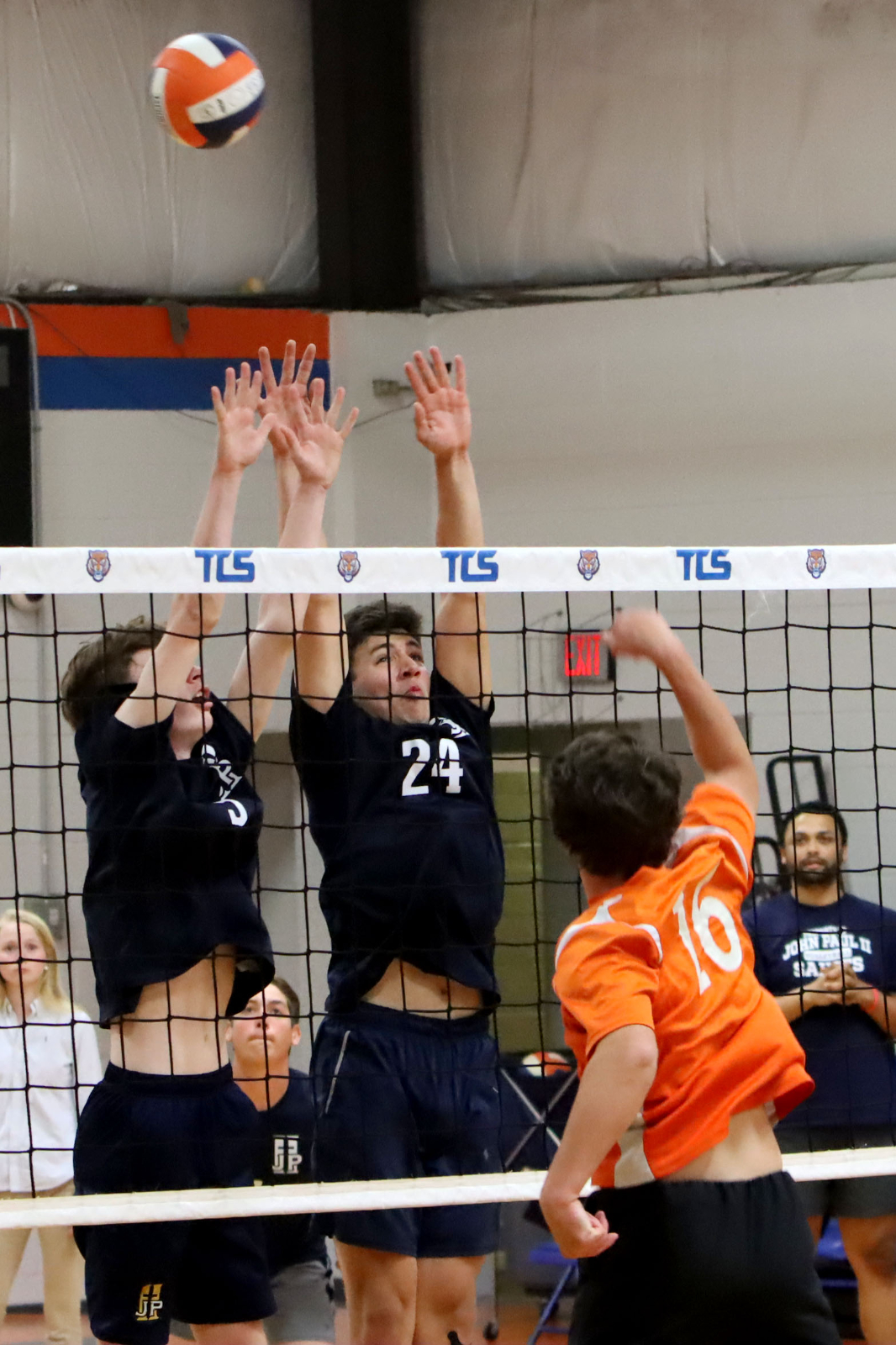 Volleyball Player receiving the ball in the court