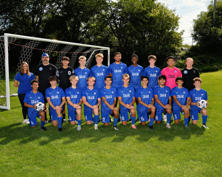 Boys varsity soccer team, boys dressed in blue uniforms