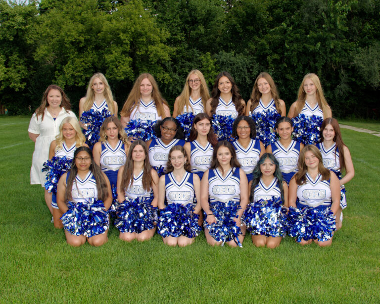 Varsity Cheer squad dressed in cheer outfits