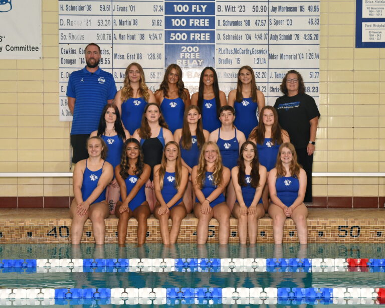 Craig Girls Swim Team posed by the pool