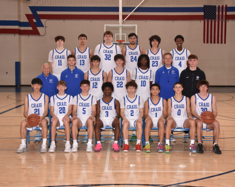 Boys Varsity Basketball Players in white uniforms