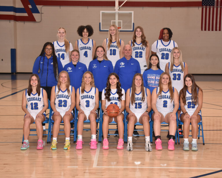 Girls Varsity basketball team in white uniforms
