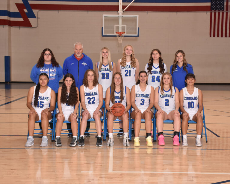 JV Girls basketball team in white uniforms