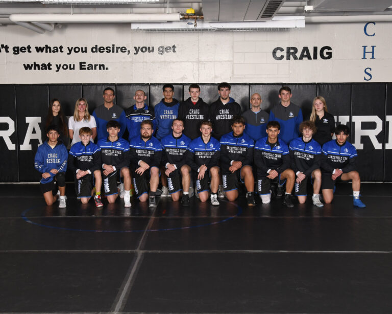 boys wrestlers in uniforms