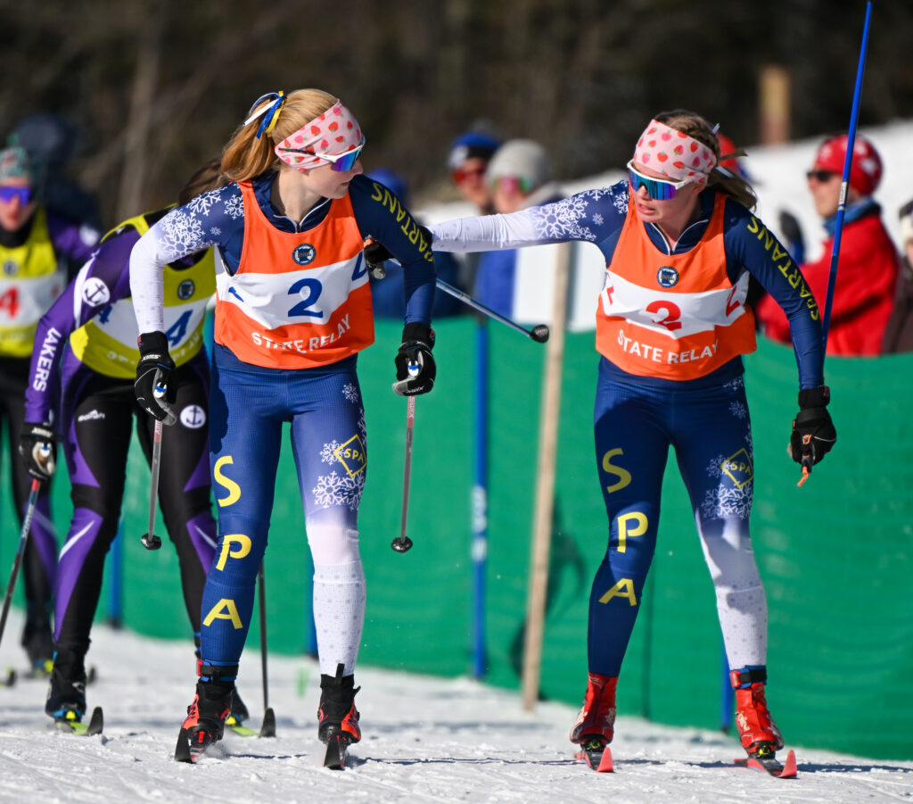 St. Paul Academy's Maren Overgaard, right, tags off with Alyda Overgaard in the final leg of the Girls Team Sprint Final race during the Nordic Ski Racing State Meet at Giants Ridge in Biwabik on Wednesday, February. 11, 2026. (Craig Lassig / Special to the Pioneer Press)