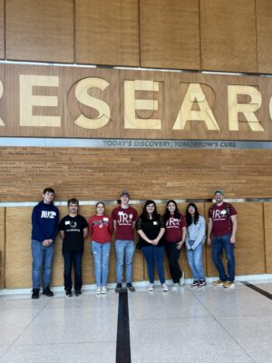 8 Janesville Research Institute students at "Cure Research" building