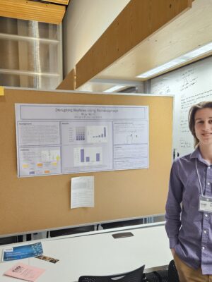 Janesville Research Institute student showing his Disrupting Biofilms Using Bactrenophage project