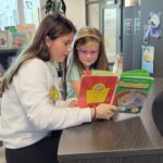 Some of Mr. Yost's high school classes came to read to us during library class!