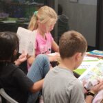 Students finding new books to love during our recent "Book Tasting" in Library class.