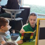 Some of Mr. Yost's high school classes came to read to us during library class!