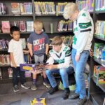 Some of Mr. Yost's high school classes came to read to us during library class!