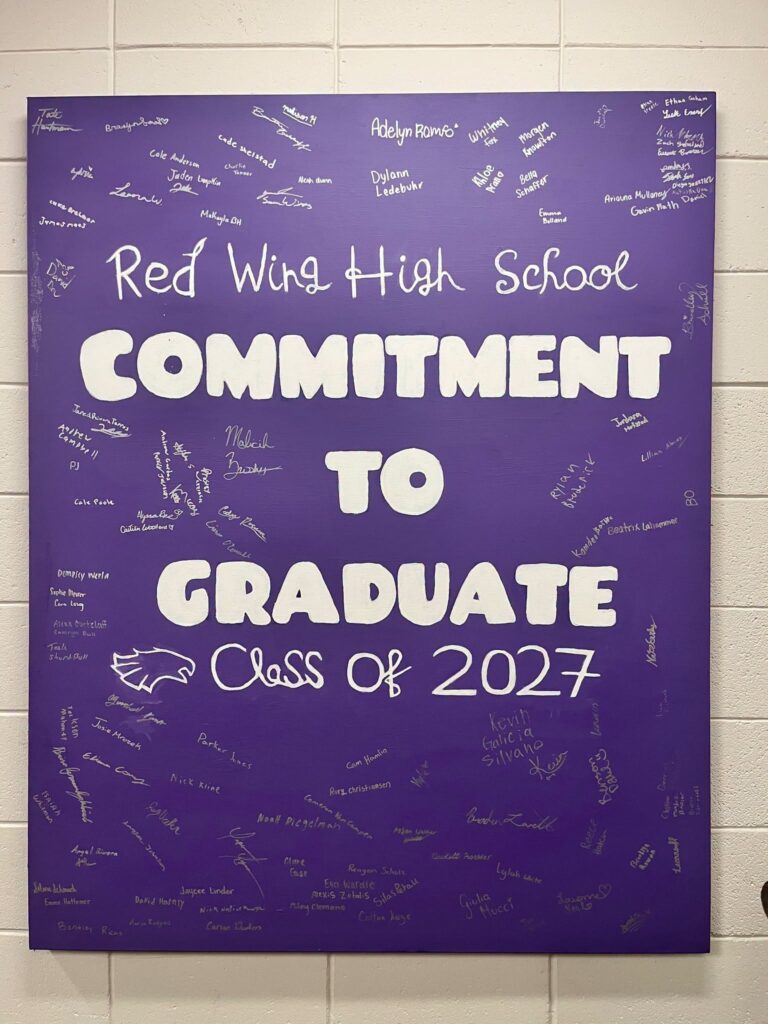 Red Wing High School Class of 2027 students signed their commitment to graduate. The canvas hangs in the high school office.