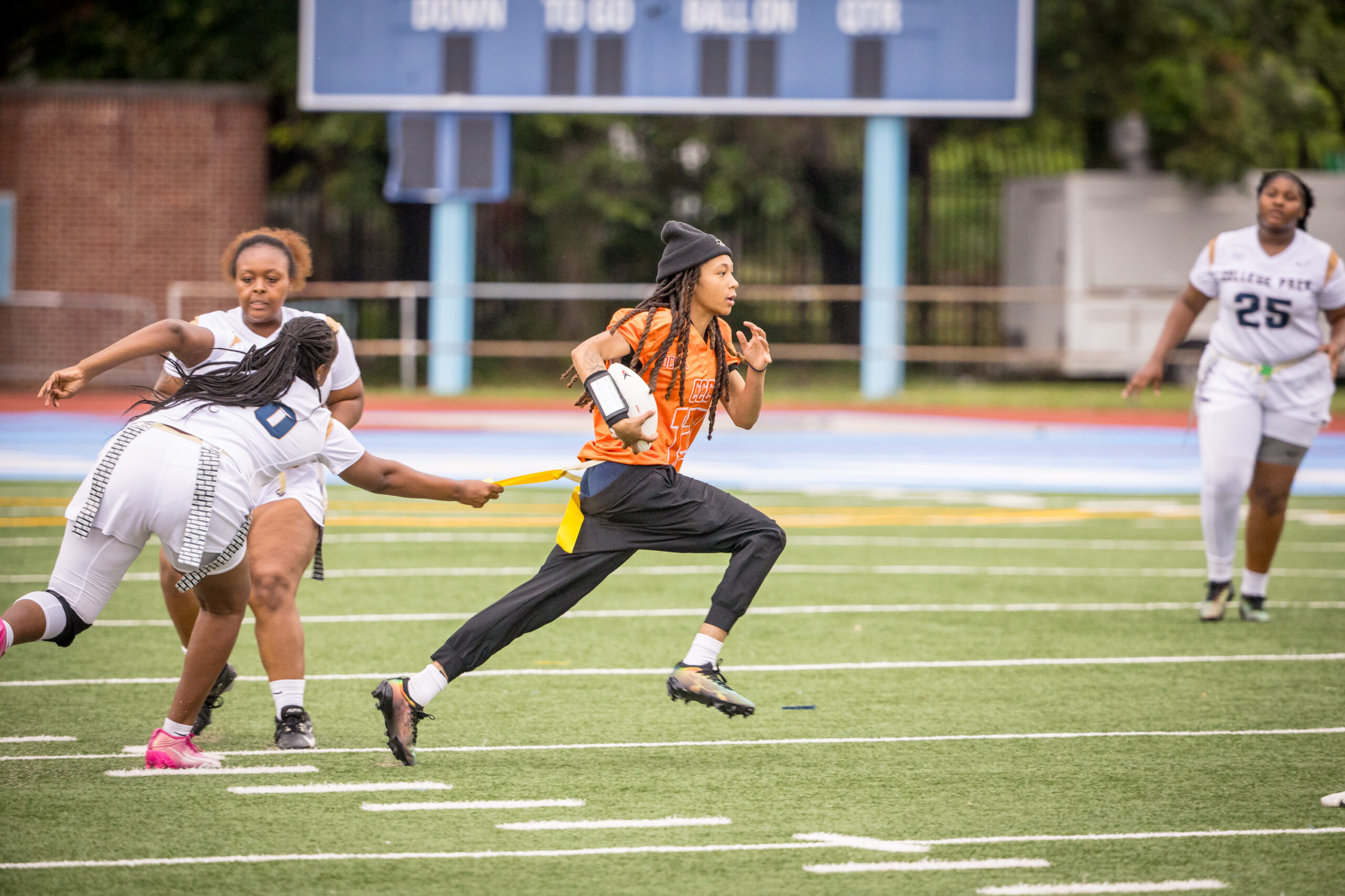 Girls trying to take down ball runnner