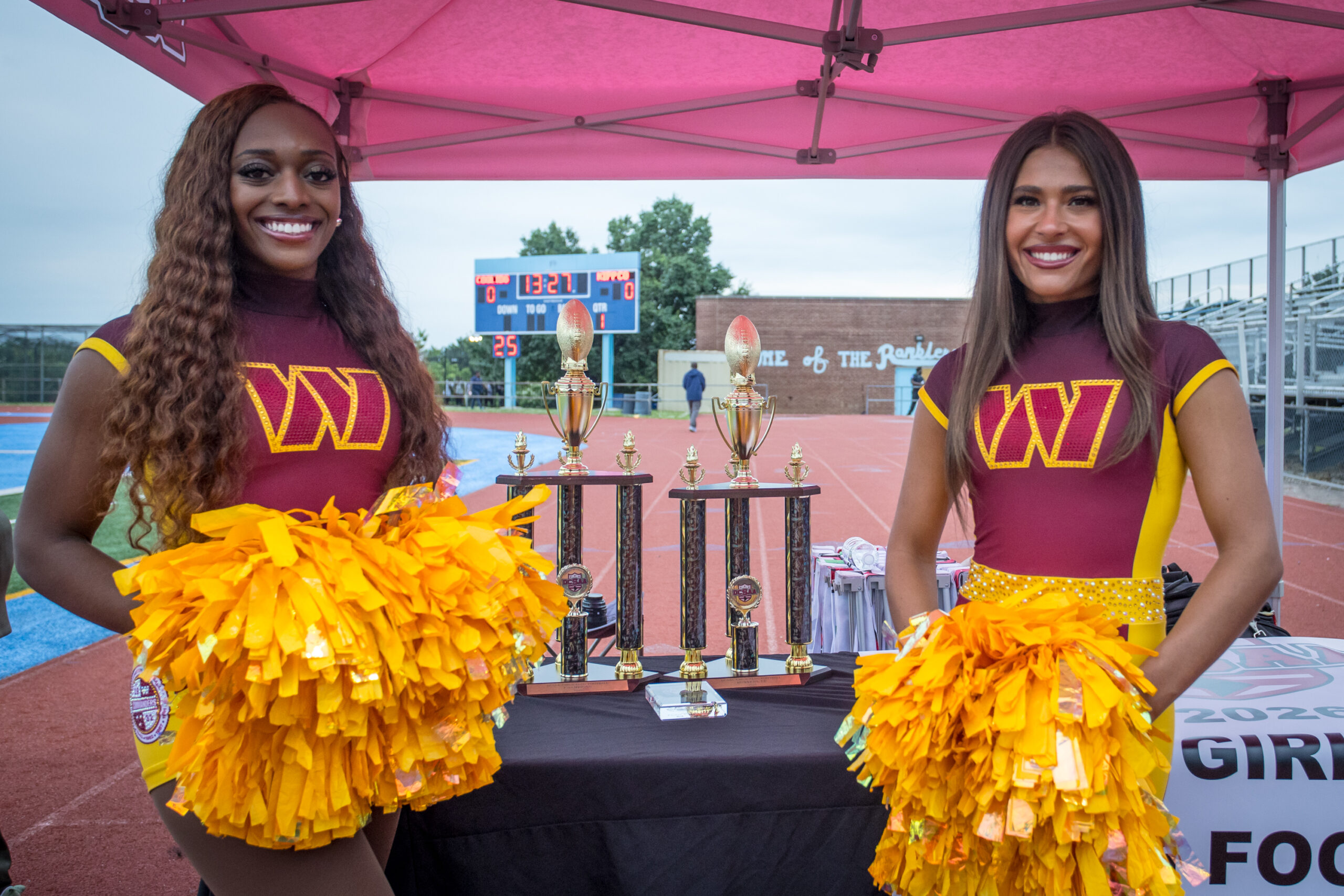 Cheerleaders by trophies
