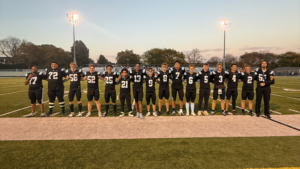 16 football seniors standing together on Senior Night