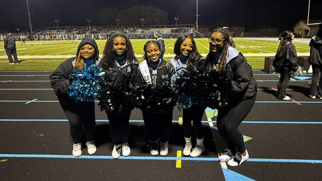 Grand Rapids Christian senior cheerleaders standing together.