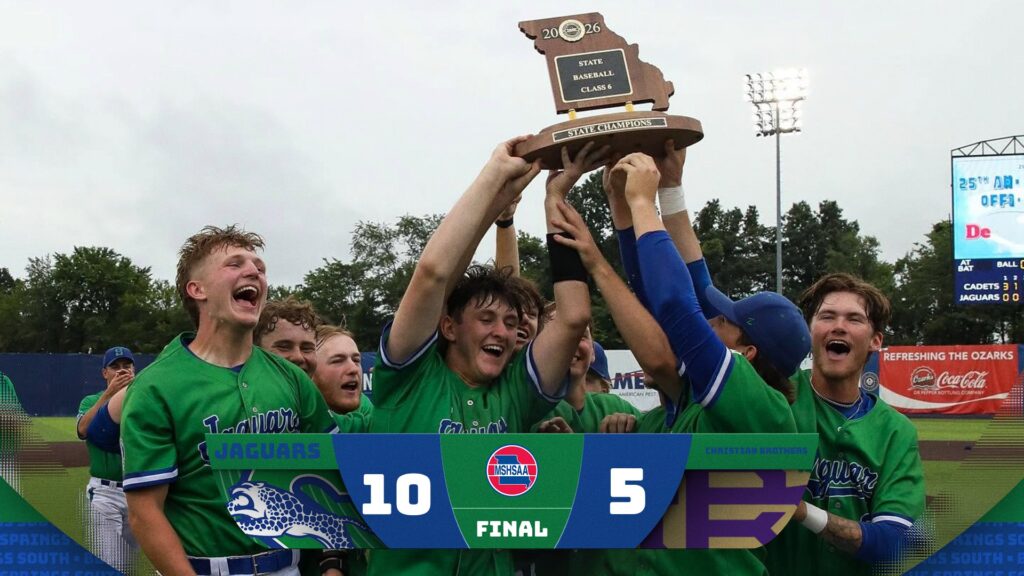Baseball players holding trophy. Score 10-5